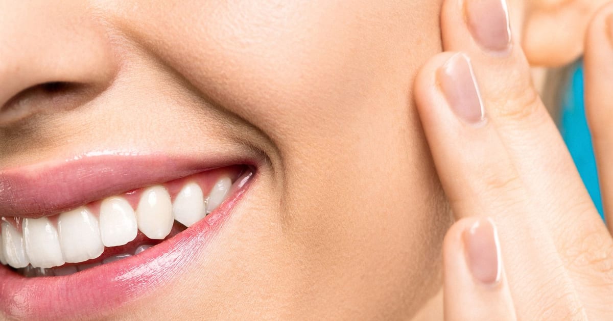 Woman with clear, healthy skin smiling